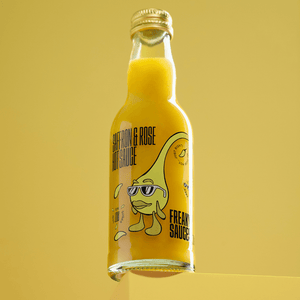 SAFFRON & ROSE bottle on yellow cube